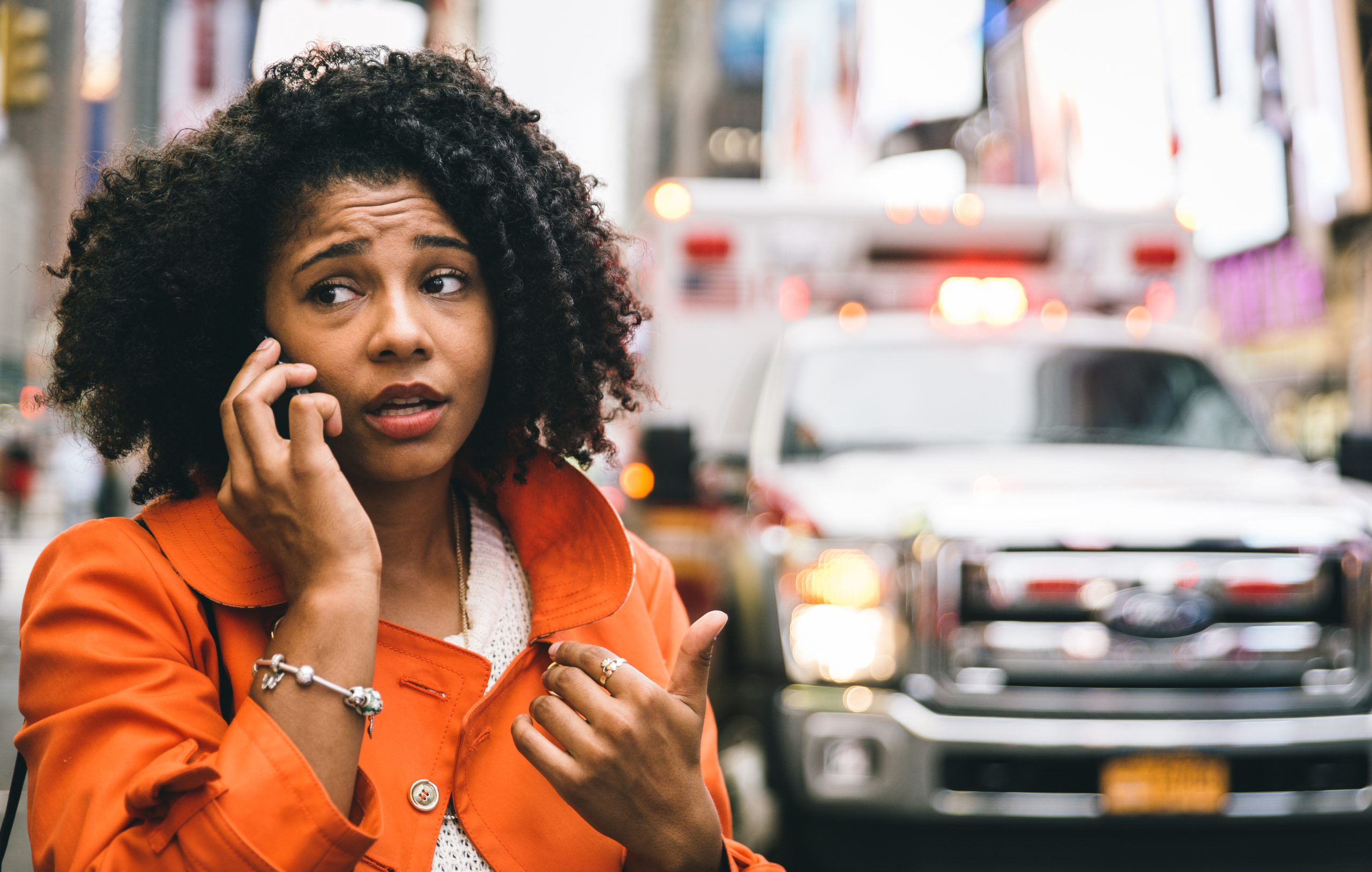 woman calling 911 in New york city. concept about car accidents and emergency
